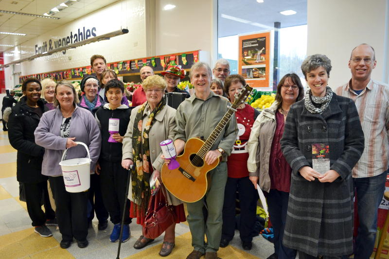 Carol singing in the Co-op