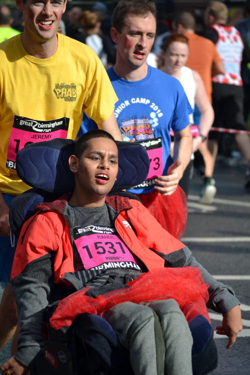 Runners pushing a wheelchair