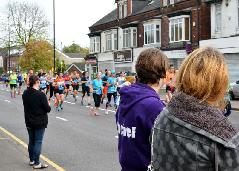 Watching the race from the pavement