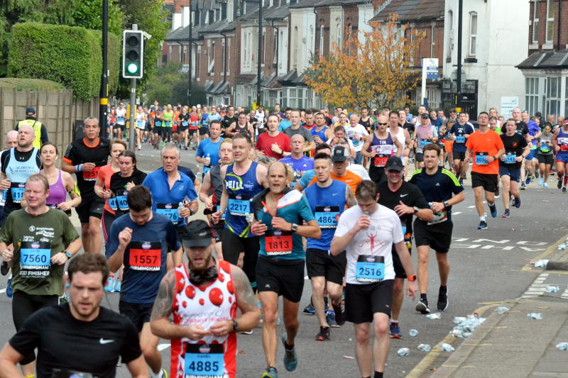 Runners in their thousands approach along Pershore Road